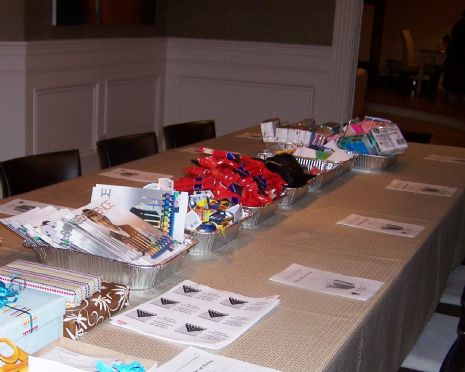At our women's event, "The Gift of Giving", we packed Chanukah gift bags to distribute at nursing homes, sampled from a gourmet latke bar, and viewed creative ways to wrap gifts.
