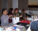 At our women's event, "The Gift of Giving", we packed Chanukah gift bags to distribute at nursing homes, sampled from a gourmet latke bar, and viewed creative ways to wrap gifts.
